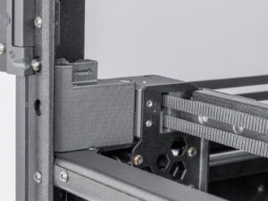 Ajustando la tensión de la correa (CORE One L, CORE One)