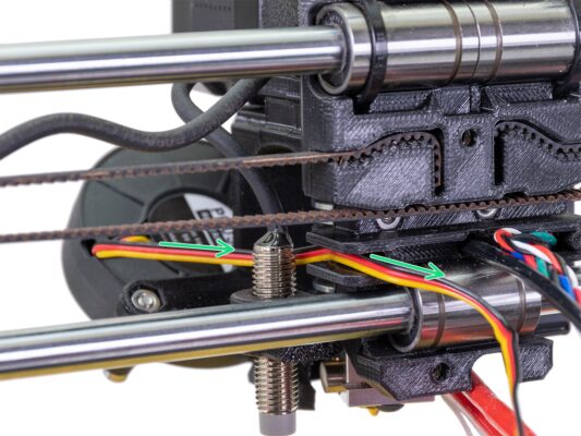 Guiding cables behind the extruder